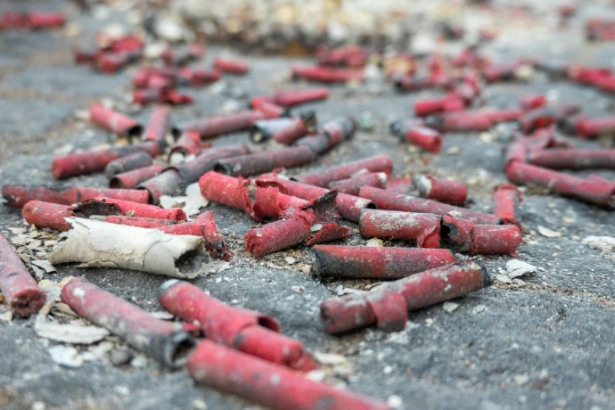a bunch of red crackers that are on the ground